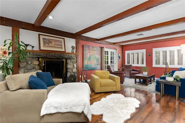 a living room with furniture fireplace and flat screen tv
