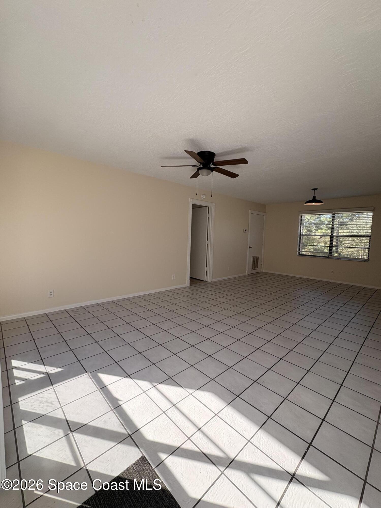 2000 Agora Circle Southeast, Unit 201 Palm Bay, FL 32909 - Photo 2 of 10 a view of an empty room and window