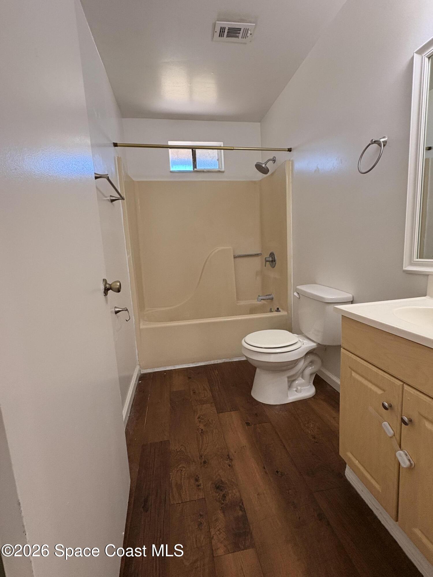 2000 Agora Circle Southeast, Unit 201 Palm Bay, FL 32909 - Photo 5 of 10 a bathroom with a toilet and a shower