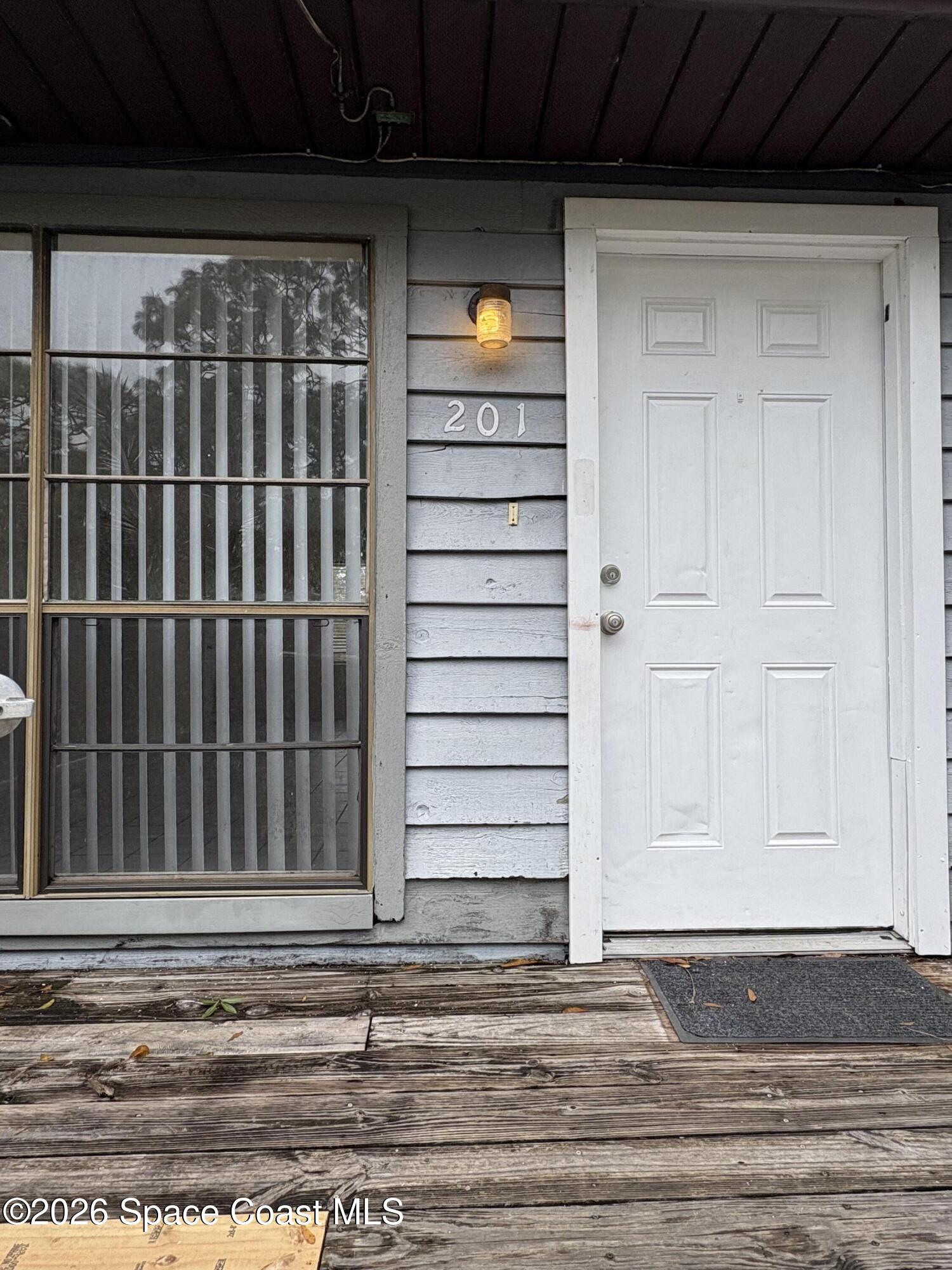 2000 Agora Circle Southeast, Unit 201 Palm Bay, FL 32909 - Photo 10 of 10 a view of a door of a house