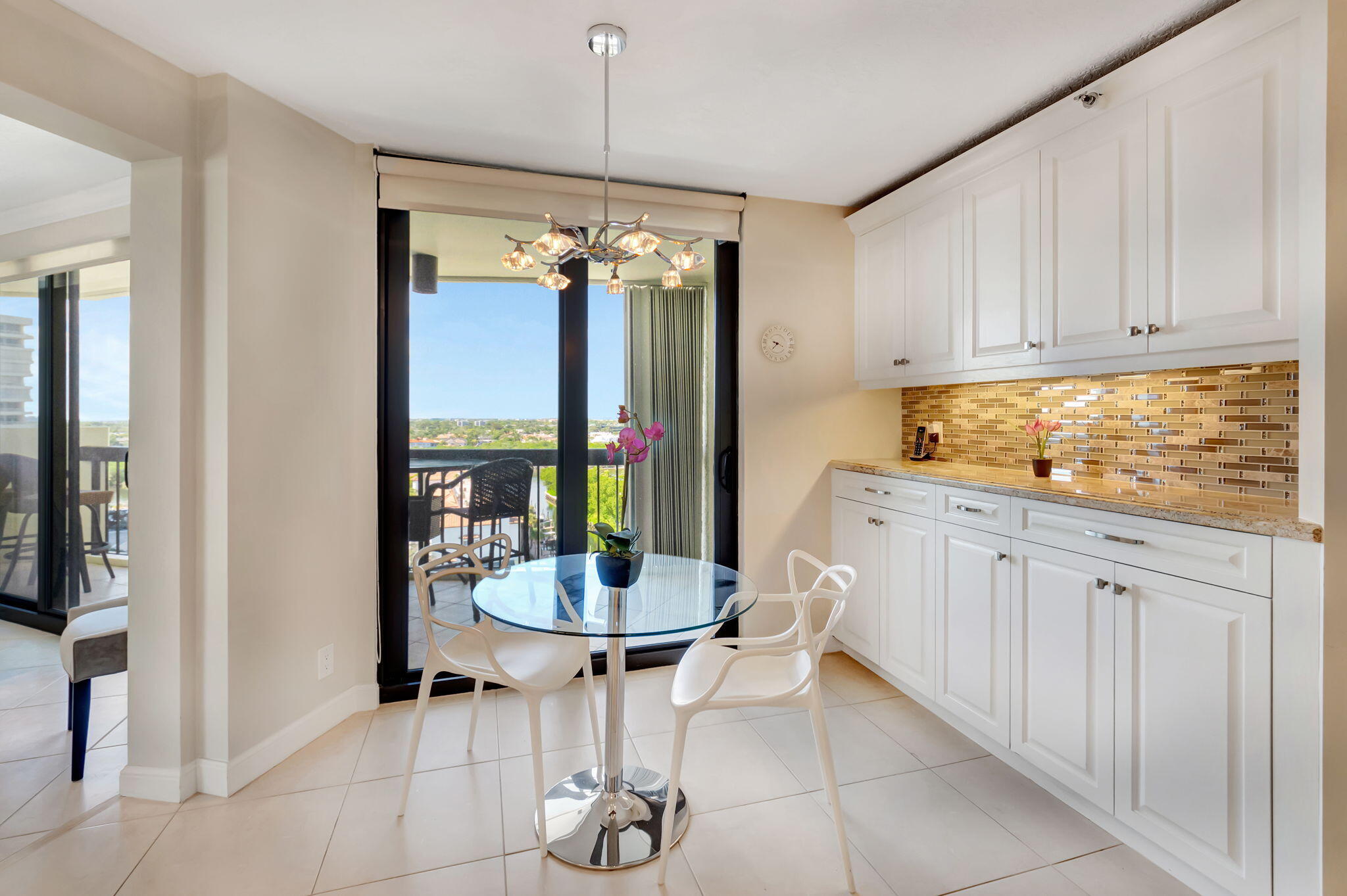 4545 North Ocean Boulevard, Unit 11C Boca Raton, FL 33431 - Photo 24 of 58 a kitchen with stainless steel appliances kitchen island granite countertop a refrigerator and a stove top oven