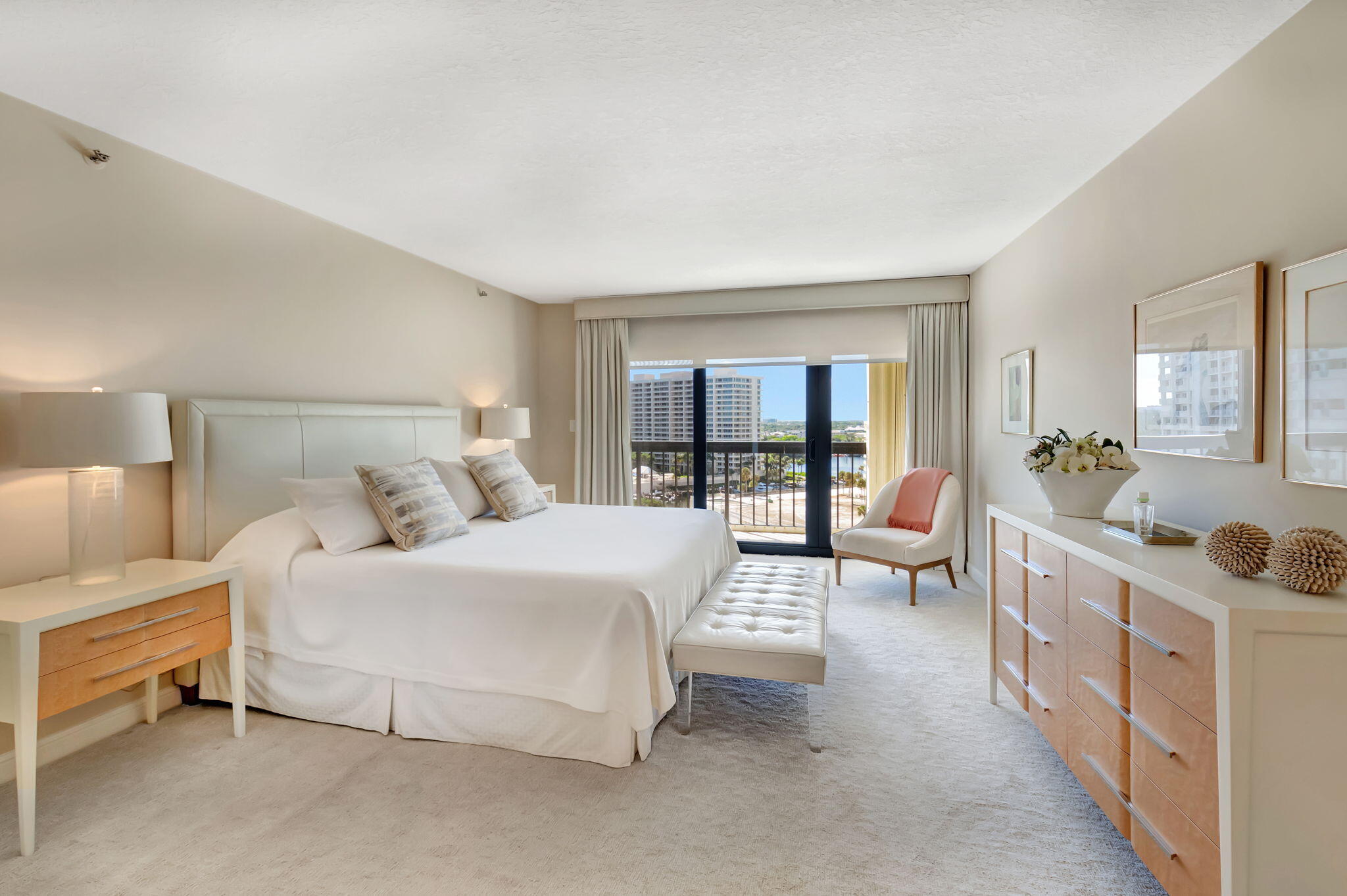 4545 North Ocean Boulevard, Unit 11C Boca Raton, FL 33431 - Photo 27 of 58 a bedroom with a bed couch a flat tv screen and a dresser