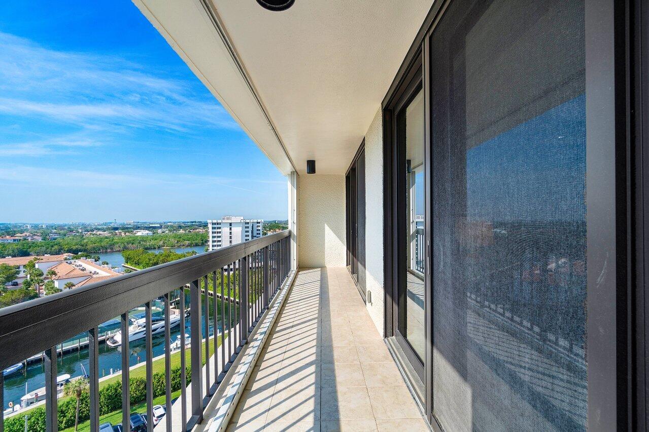 4545 North Ocean Boulevard, Unit 11C Boca Raton, FL 33431 - Photo 32 of 58 a view of a balcony with wooden floor