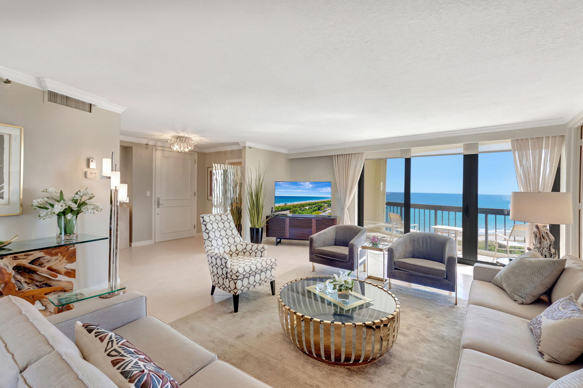 4545 North Ocean Boulevard, Unit 11C Boca Raton, FL 33431 - Photo 4 of 58 a living room with furniture and a large window
