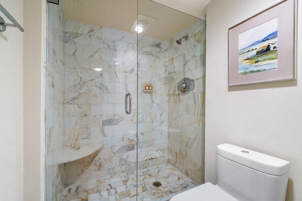 4545 North Ocean Boulevard, Unit 11C Boca Raton, FL 33431 - Photo 42 of 58 a bathroom with a shower and toilet