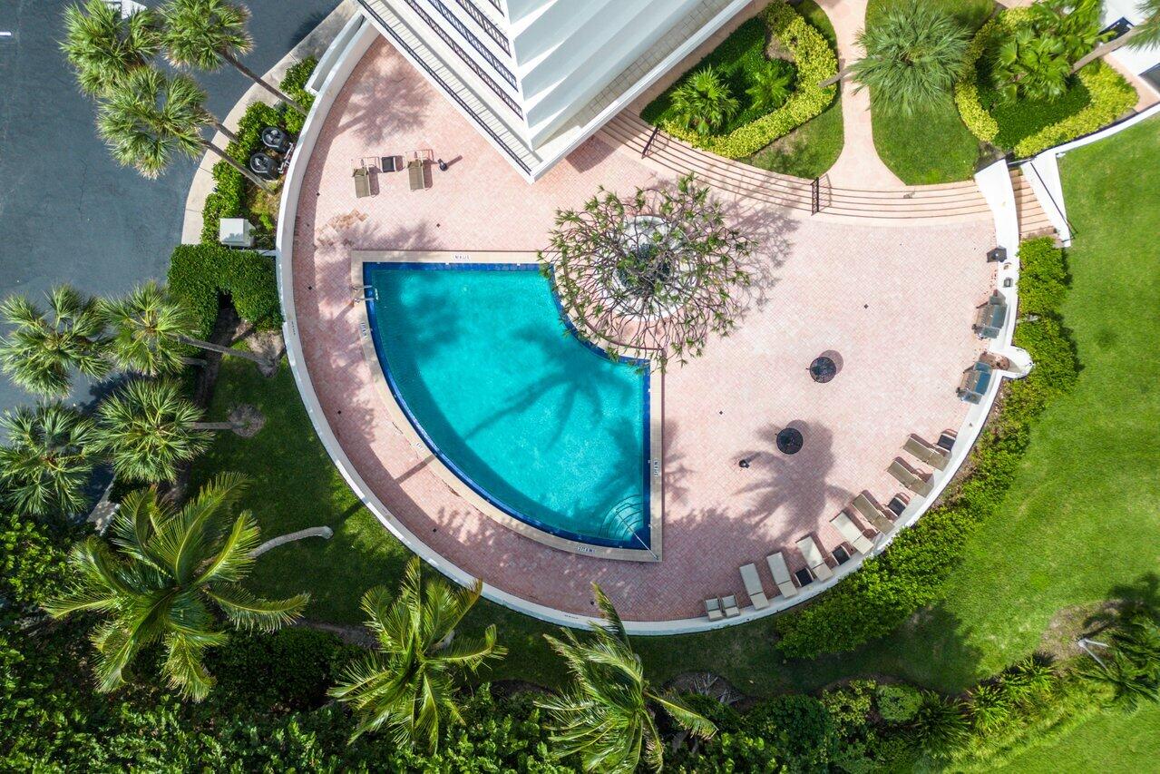 4545 North Ocean Boulevard, Unit 11C Boca Raton, FL 33431 - Photo 49 of 58 an aerial view of a house with a garden and trees