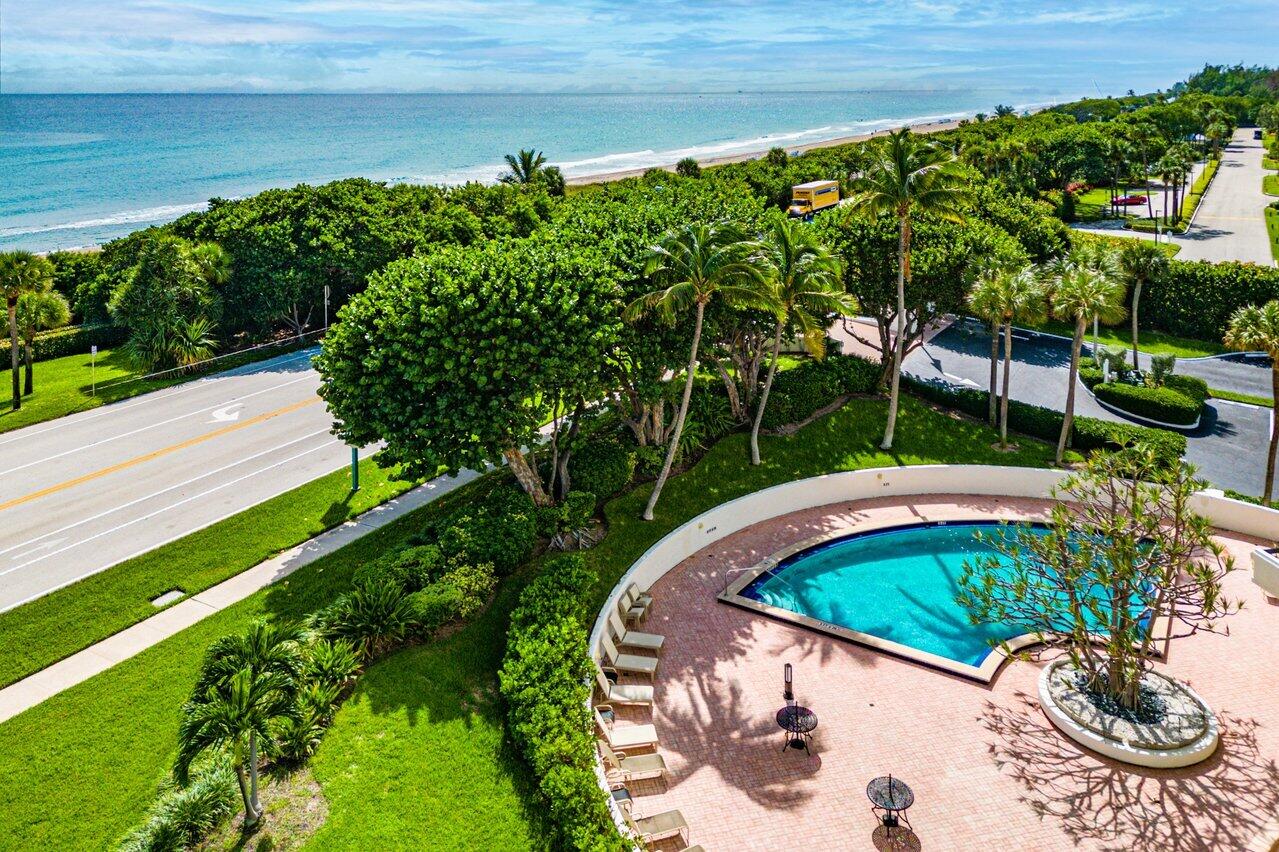 4545 North Ocean Boulevard, Unit 11C Boca Raton, FL 33431 - Photo 50 of 58 a view of a swimming pool with a patio