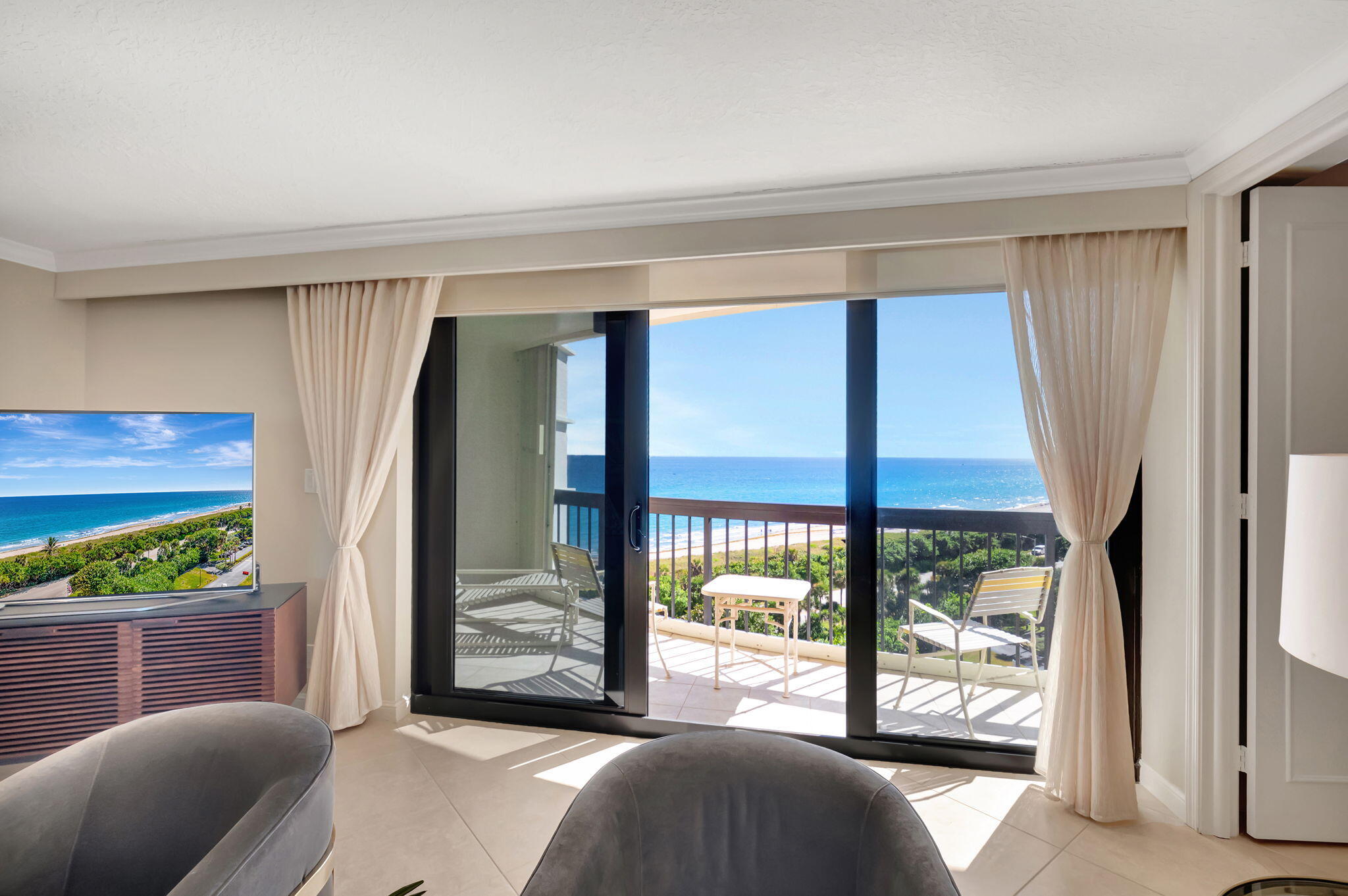 4545 North Ocean Boulevard, Unit 11C Boca Raton, FL 33431 - Photo 7 of 58 a bedroom with a bed and a large window