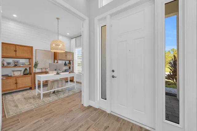a large kitchen with a lot of counter space and stainless steel appliances