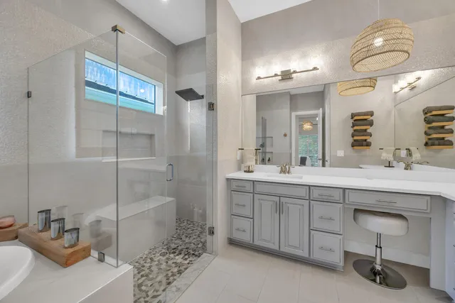 a white bath tub sitting next to a white sink