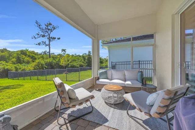a building outdoor space with patio furniture and a patio