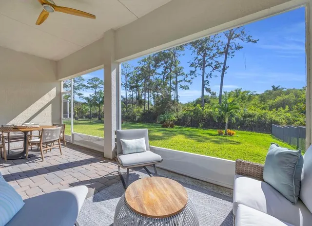 a front view of a house with a garden and yard