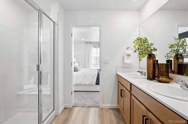 a bedroom with a bed and lamp