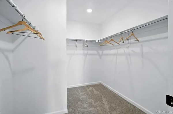 a bedroom with furniture and window