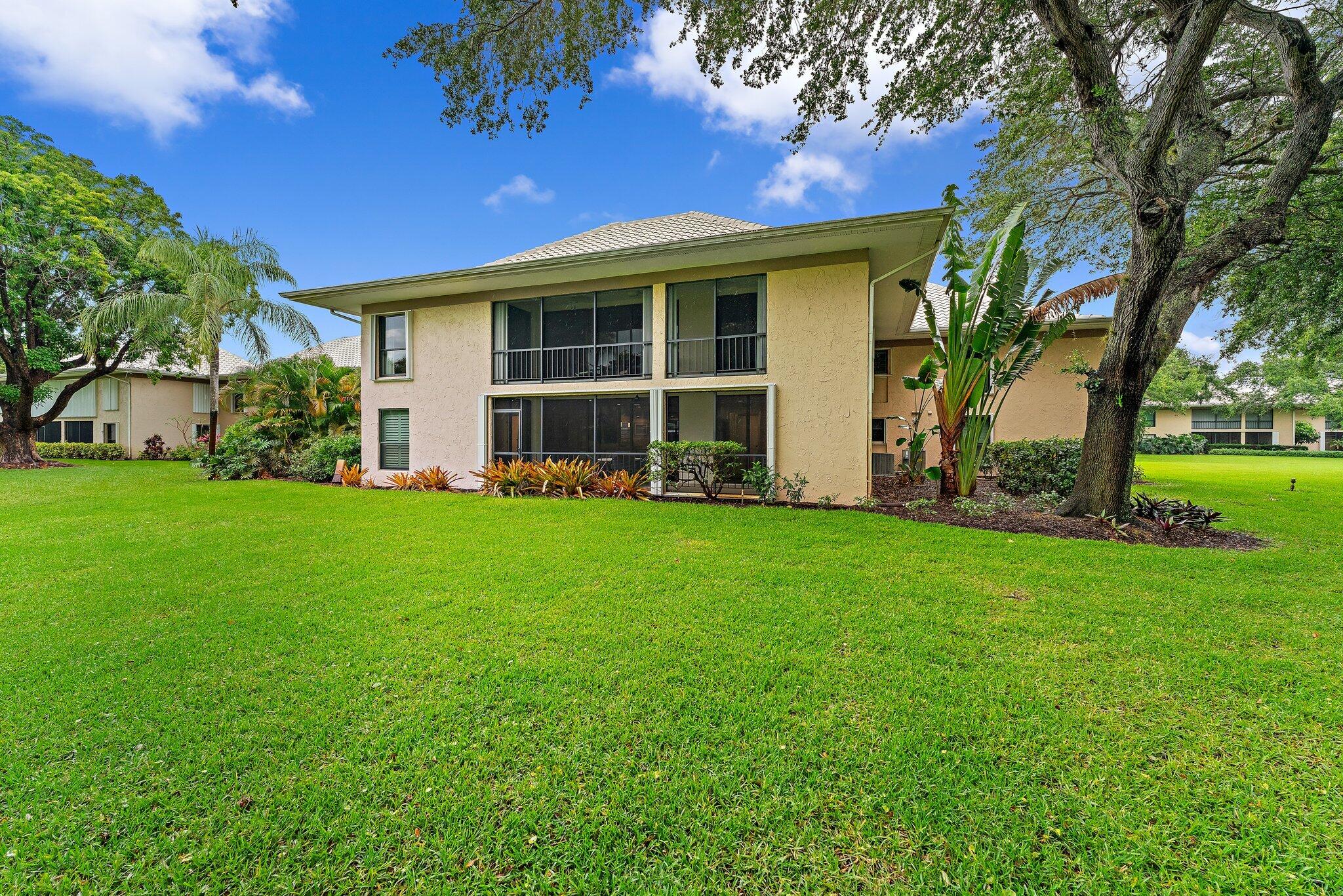 10 Southeast Turtle Creek Drive, Unit A Tequesta, FL 33469 - Photo 1 of 20 a view of a house with backyard