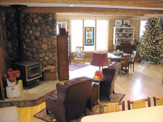 20820 Free Church Road Caledonia, IL 61011 - Photo 5 of 6 a living room with furniture a dining table and a potted plant