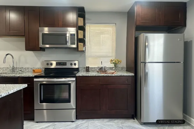 a kitchen with a sink and a microwave