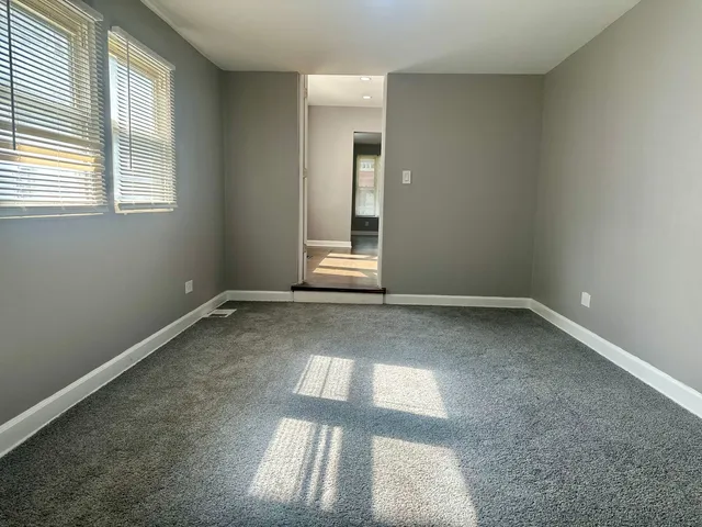 an empty room with a empty space and window