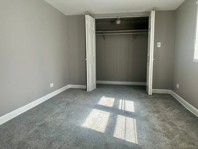 an empty room with cabinet