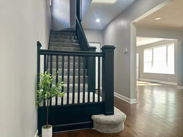 a view of entryway with wooden floor