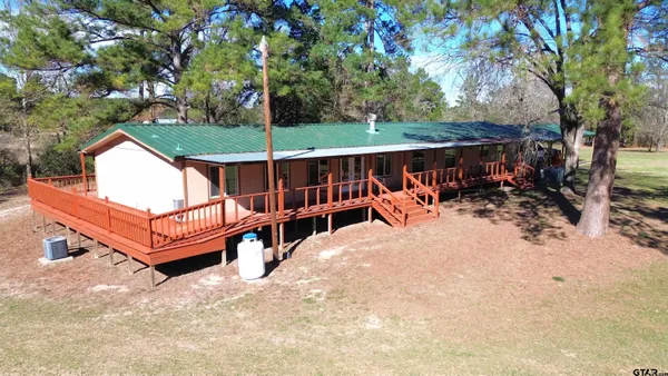 an aerial view of houses with yard