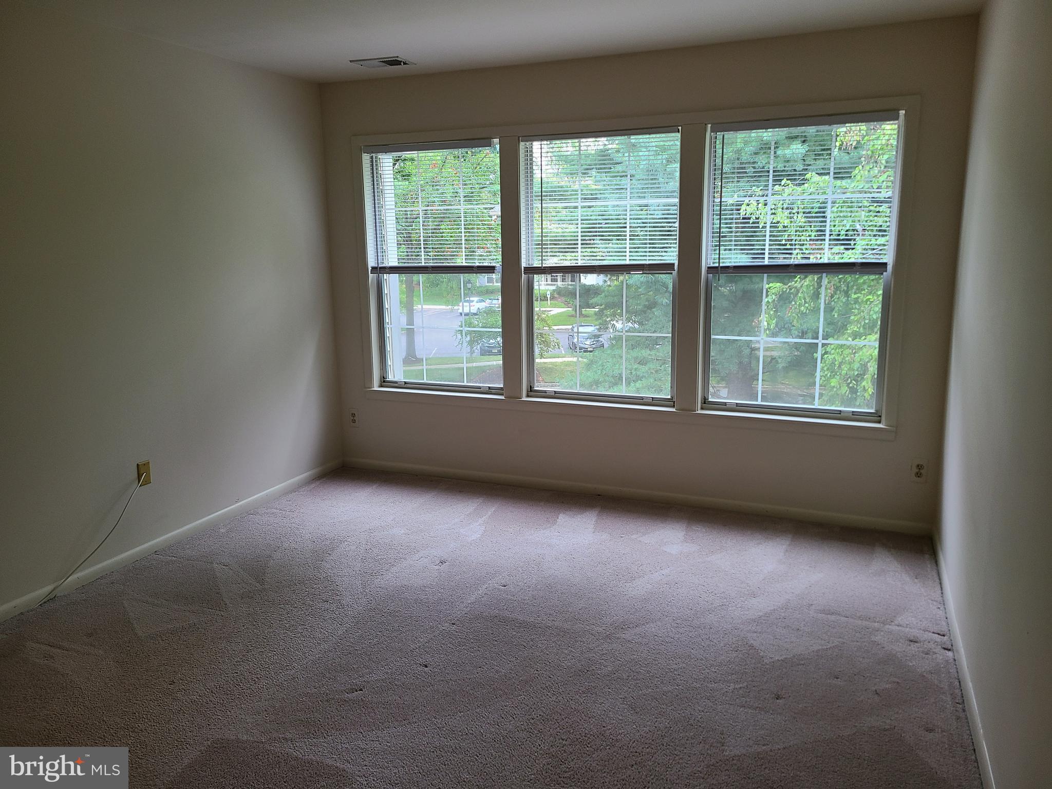 308 Trinity Court, Unit 11 Princeton, NJ 08540 - Photo 3 of 7 an empty room with a window
