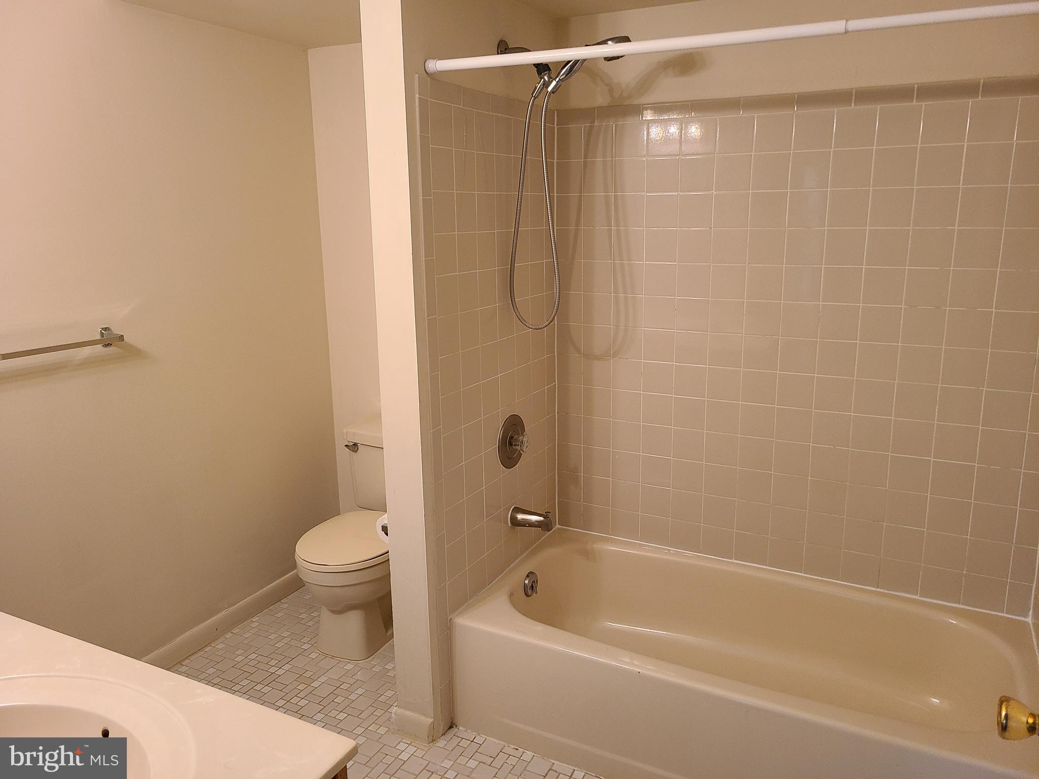 308 Trinity Court, Unit 11 Princeton, NJ 08540 - Photo 6 of 7 a bathroom with a shower a bathtub and toilet