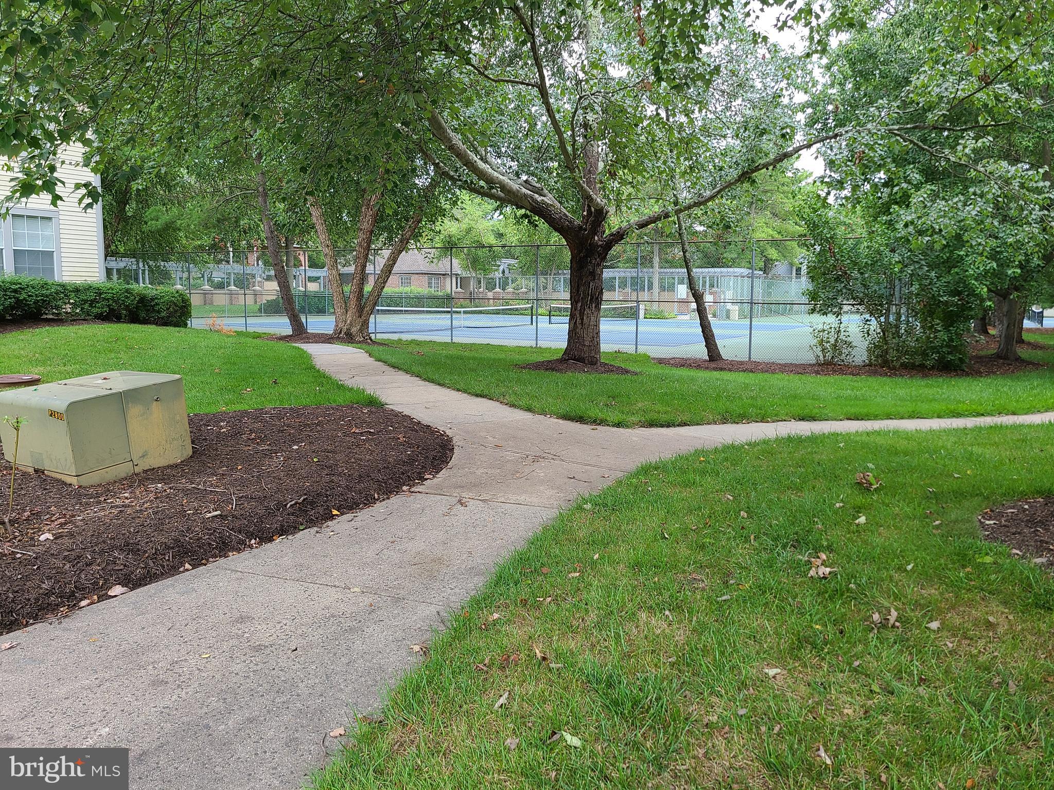 308 Trinity Court, Unit 11 Princeton, NJ 08540 - Photo 7 of 7 a view of a garden with trees and playing ground
