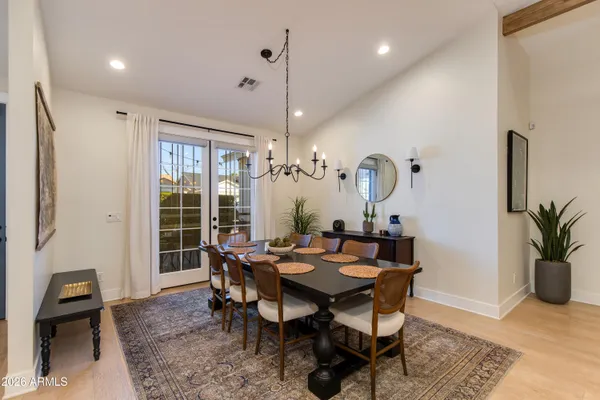 a view of a dining room with furniture window and wooden floor