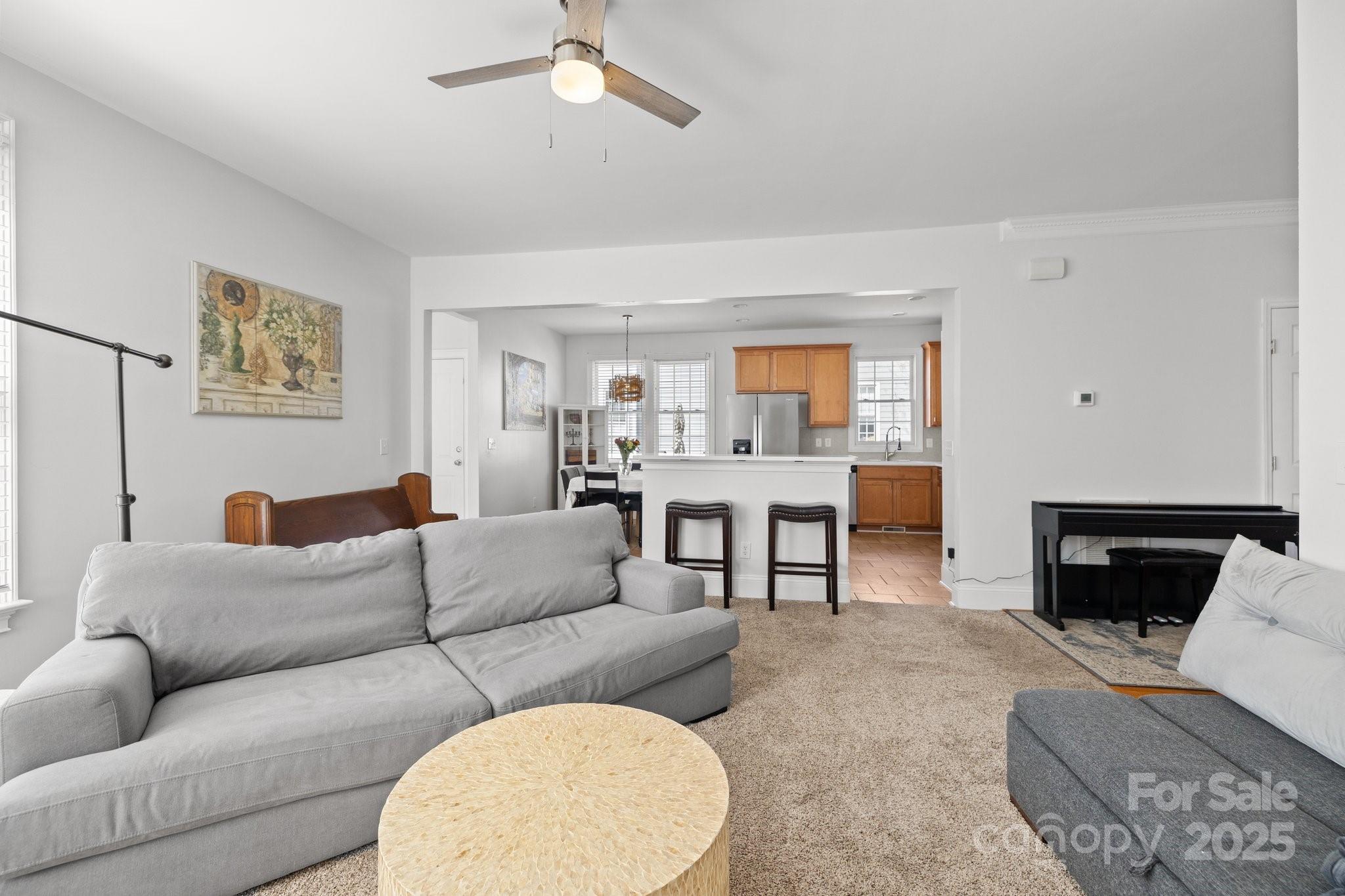 3208 Fifth Baxter Crossing Fort Mill, SC 29708 - Photo 11 of 38 a living room with furniture and a fireplace