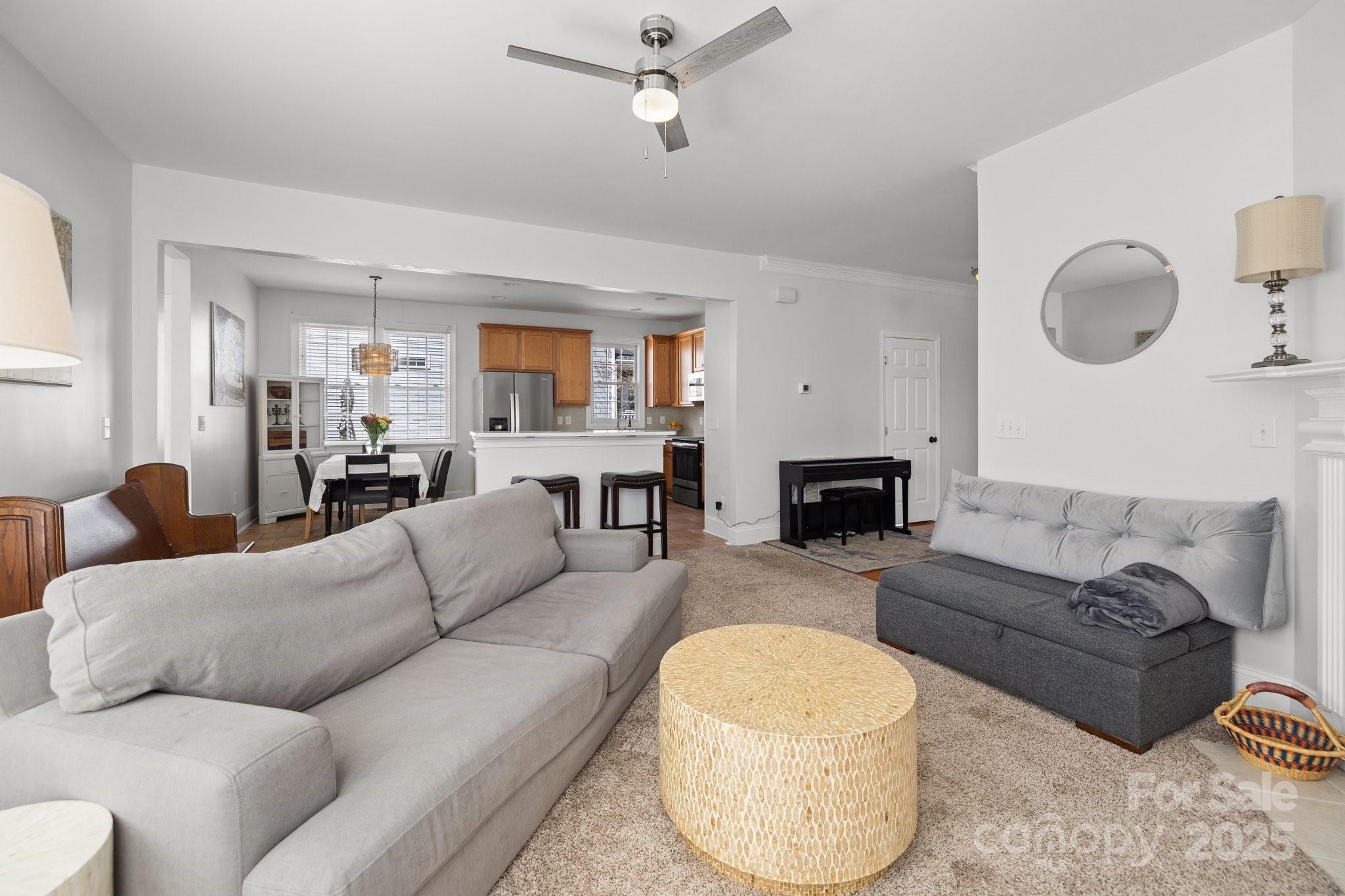 3208 Fifth Baxter Crossing Fort Mill, SC 29708 - Photo 12 of 38 a living room with furniture a fireplace and a window
