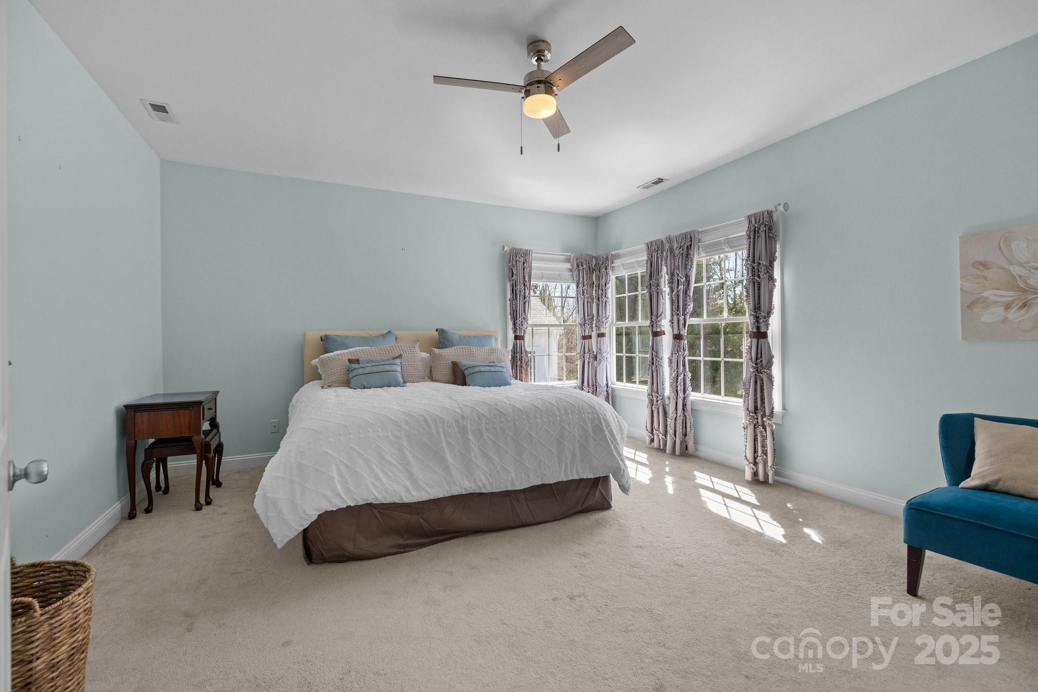 3208 Fifth Baxter Crossing Fort Mill, SC 29708 - Photo 20 of 38 a spacious bedroom with a bed a desk and chair