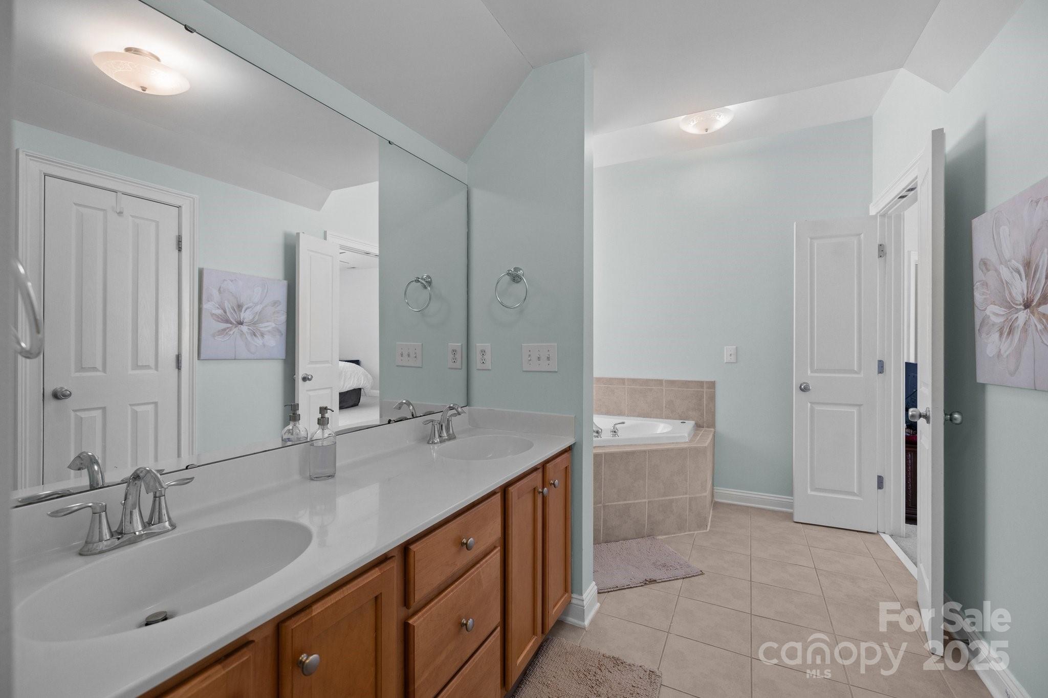 3208 Fifth Baxter Crossing Fort Mill, SC 29708 - Photo 23 of 38 a bathroom with a sink double vanity granite tub and shower