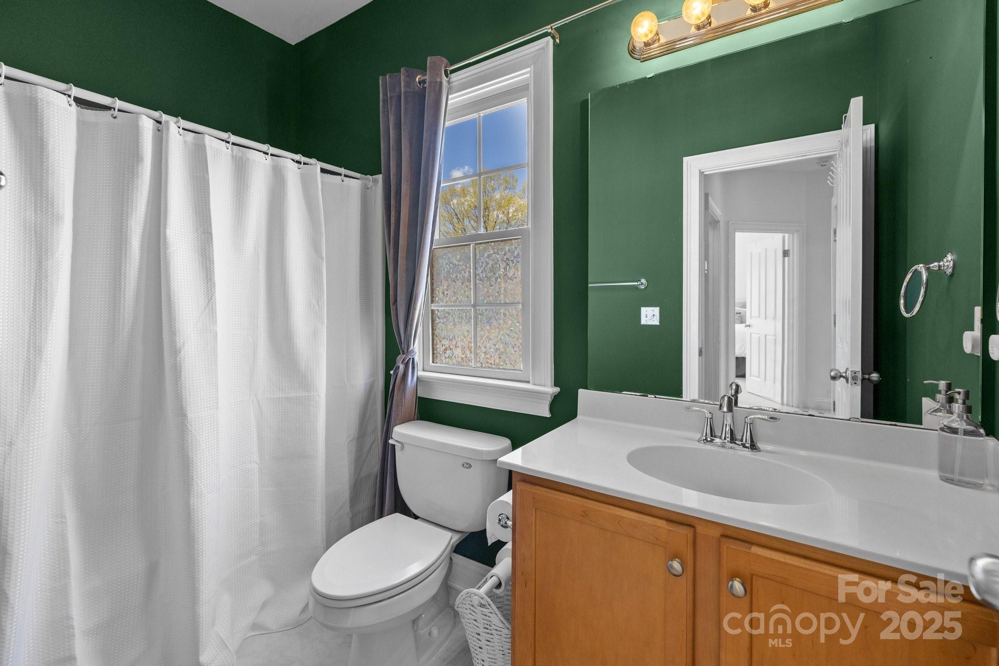 3208 Fifth Baxter Crossing Fort Mill, SC 29708 - Photo 28 of 38 a bathroom with a granite countertop sink toilet and a mirror