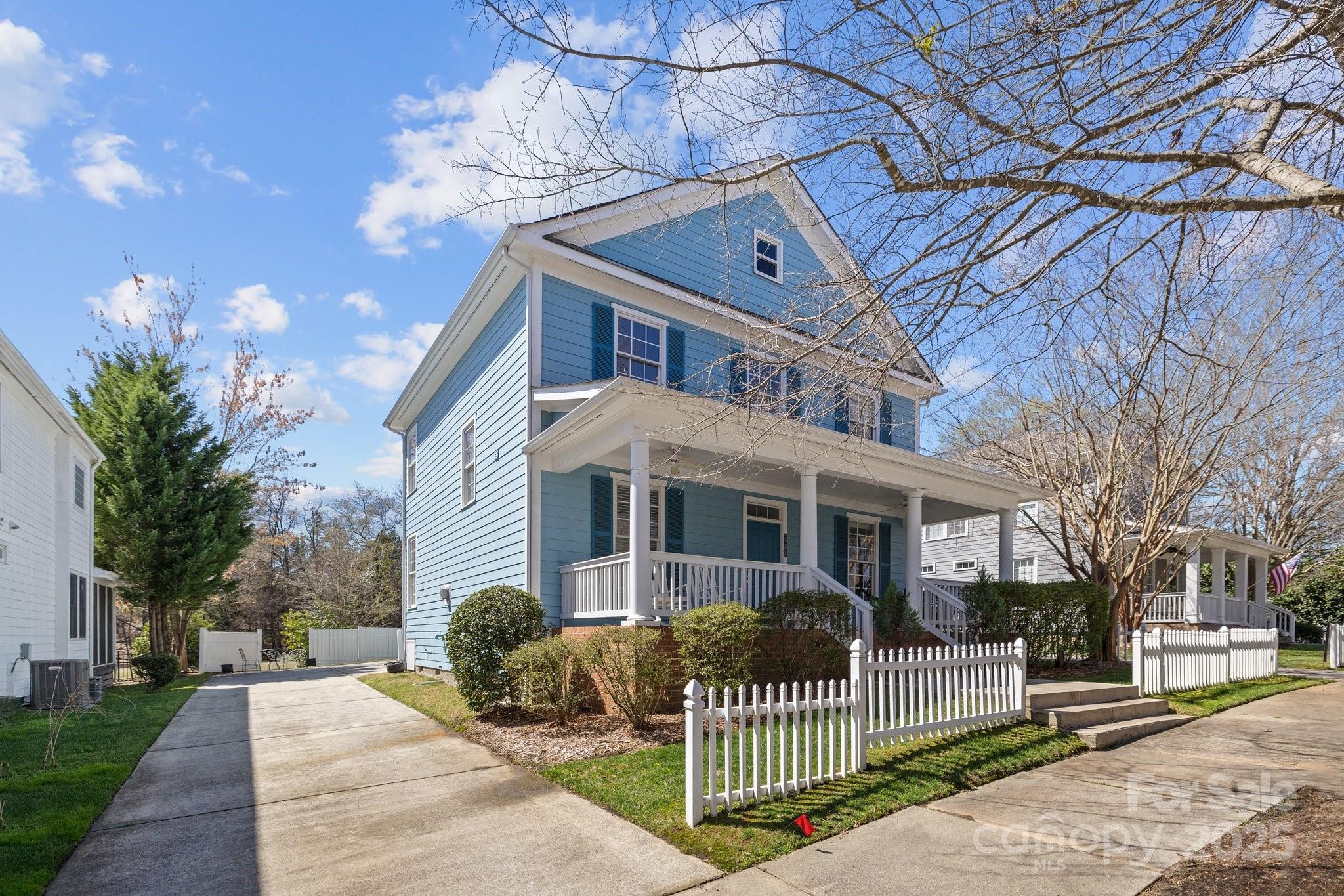 3208 Fifth Baxter Crossing Fort Mill, SC 29708 - Photo 30 of 38 a front view of a house with iron fence