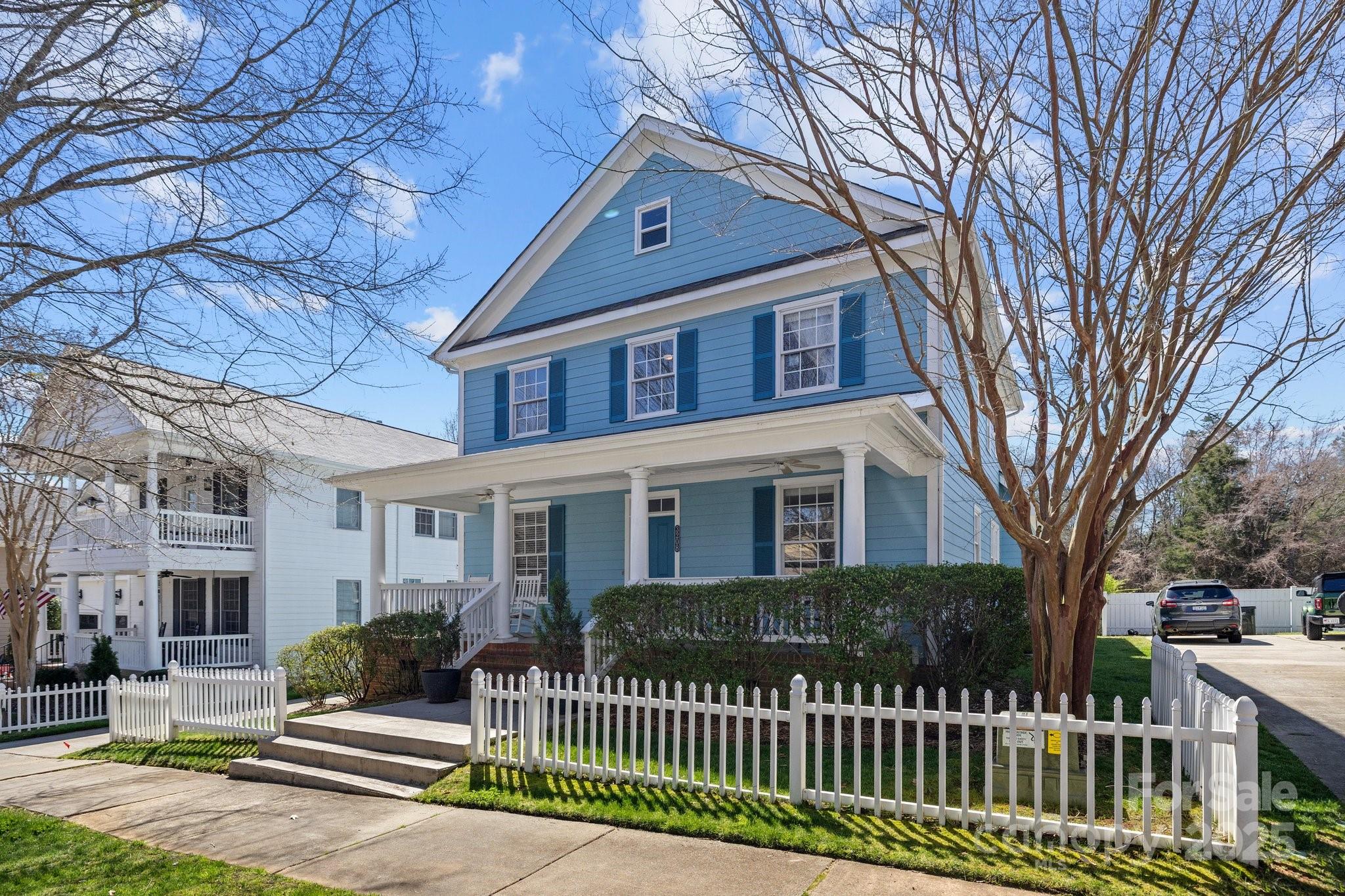 3208 Fifth Baxter Crossing Fort Mill, SC 29708 - Photo 3 of 38 a front view of a house with a garden