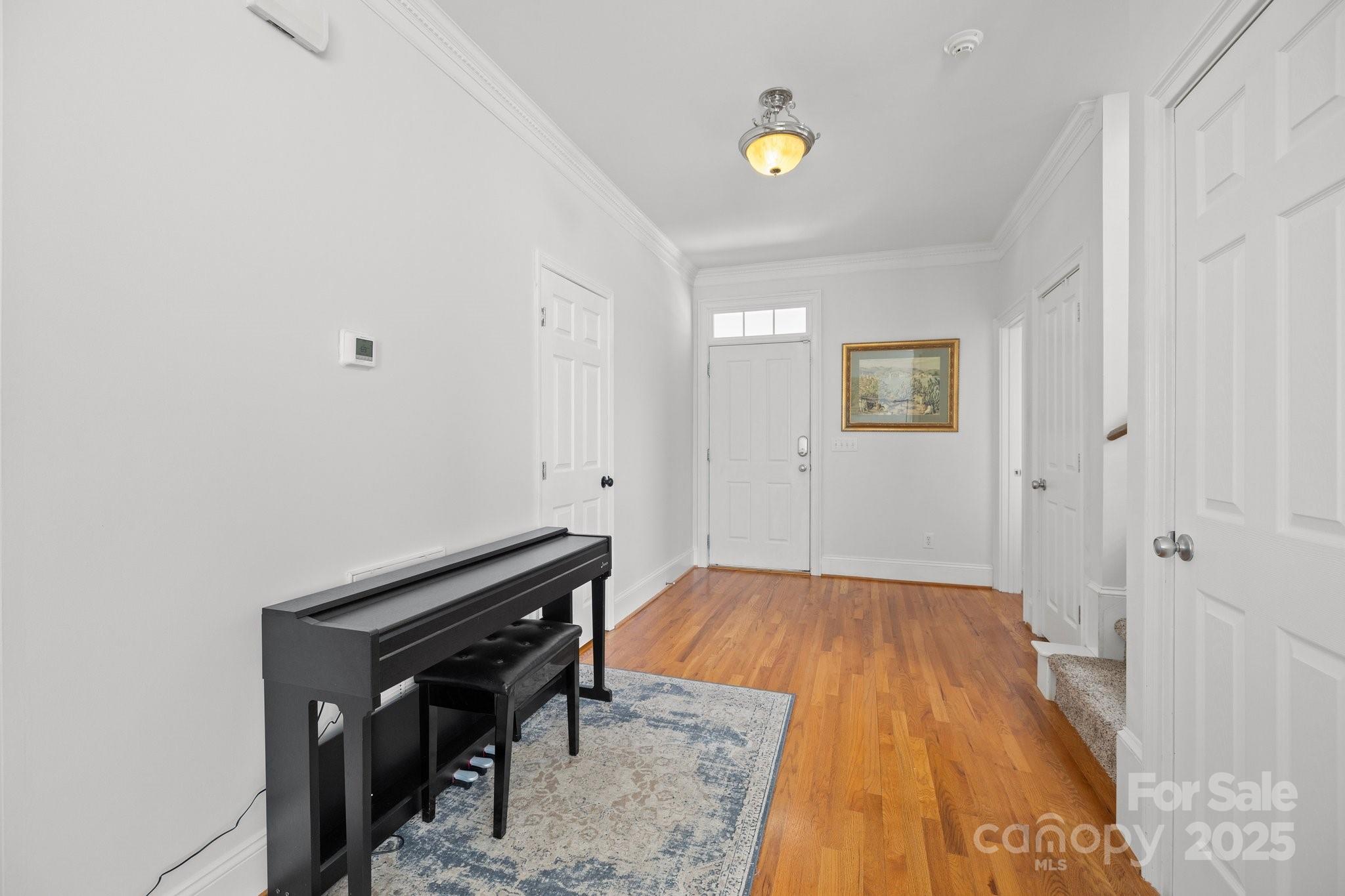 3208 Fifth Baxter Crossing Fort Mill, SC 29708 - Photo 5 of 38 a view of a bedroom with wooden floor and window