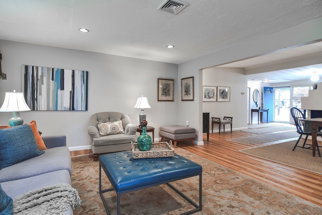 52 Lohnes Road Framingham, MA 01701 - Photo 12 of 34 a living room with furniture a rug and a table