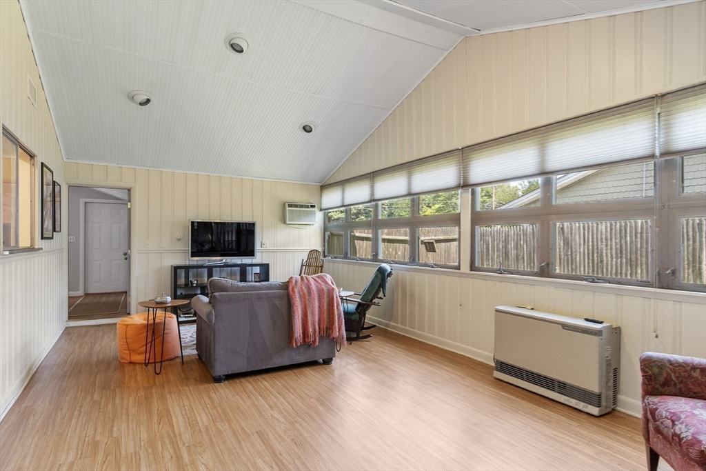 52 Lohnes Road Framingham, MA 01701 - Photo 13 of 34 a living room with furniture and a flat screen tv