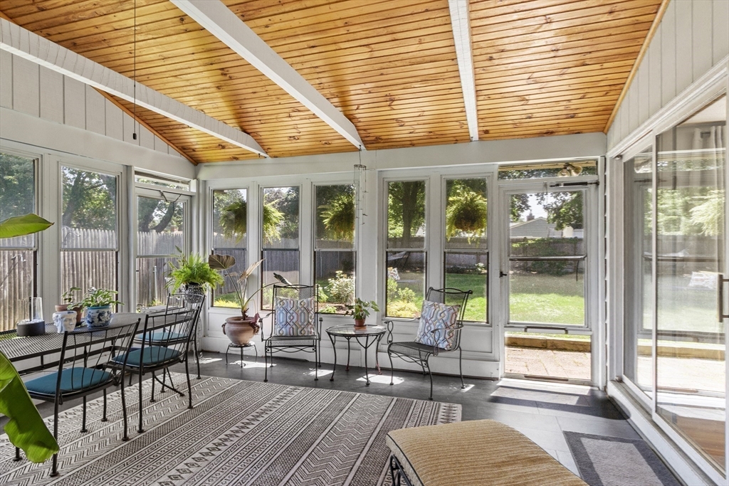 52 Lohnes Road Framingham, MA 01701 - Photo 16 of 34 a view of a patio with table and chairs and potted plants