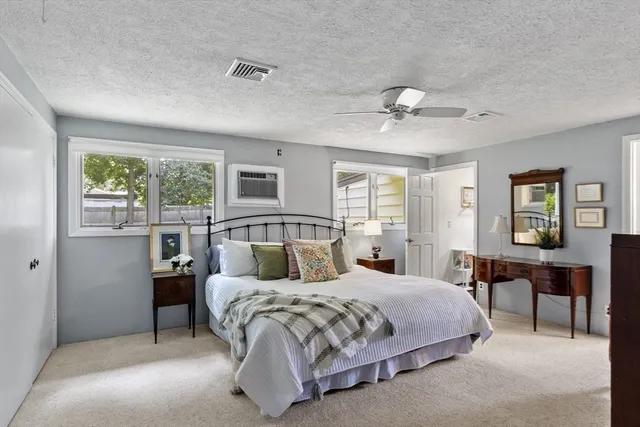 a bedroom with a bed and dresser