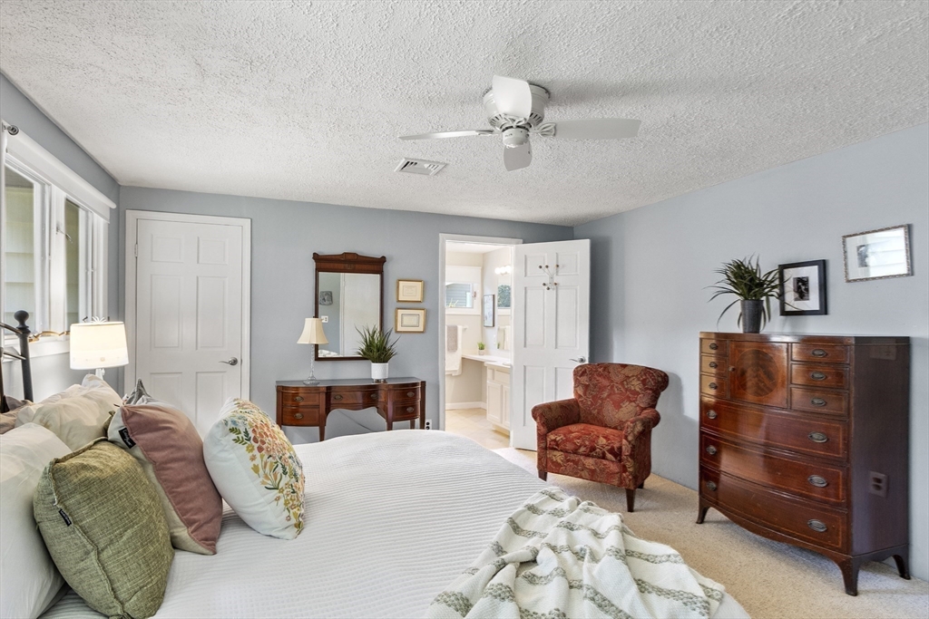 52 Lohnes Road Framingham, MA 01701 - Photo 20 of 34 a spacious bedroom with a bed and dresser