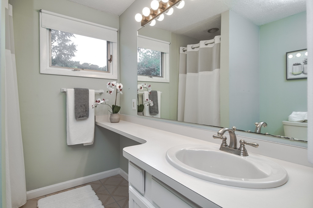 52 Lohnes Road Framingham, MA 01701 - Photo 21 of 34 a bathroom with a sink and a mirror