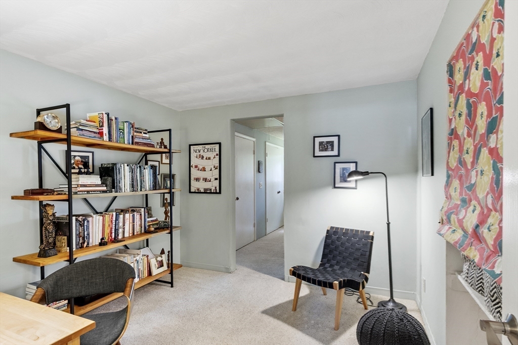 52 Lohnes Road Framingham, MA 01701 - Photo 22 of 34 a living room with furniture and a book shelf