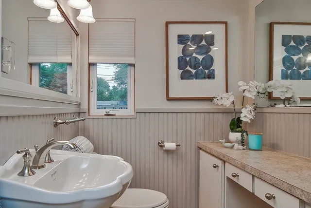 a bedroom with a bed and a table