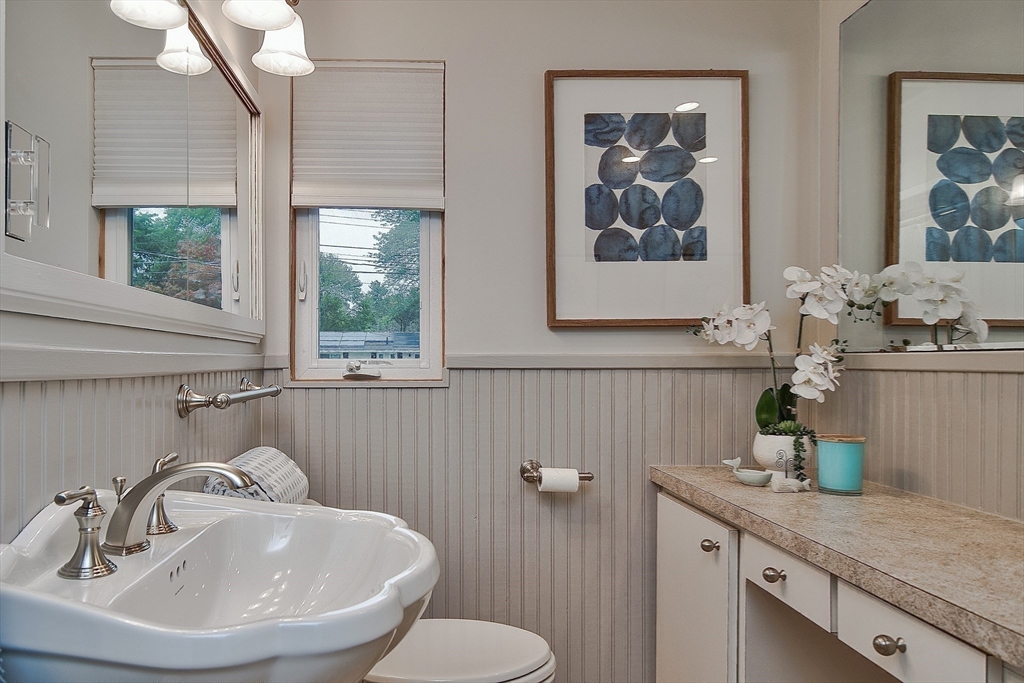 52 Lohnes Road Framingham, MA 01701 - Photo 24 of 34 a bathroom with a sink a mirror and a toilet