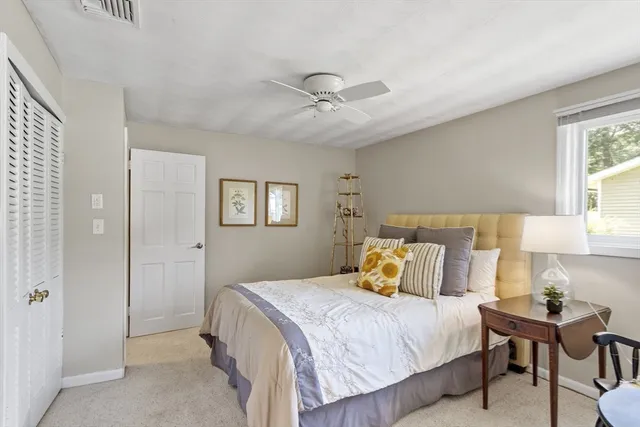 a bed room with a bed and a chandelier