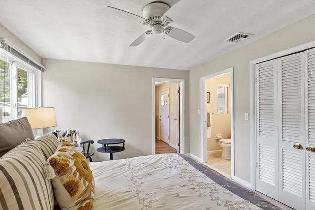 a bathroom with a sink mirror and toilet