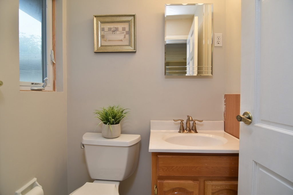 52 Lohnes Road Framingham, MA 01701 - Photo 27 of 34 a bathroom with a sink mirror and toilet