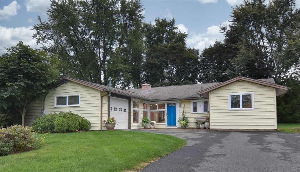 52 Lohnes Road Framingham, MA 01701 - Photo 32 of 34 a view of a house with a yard and potted plants